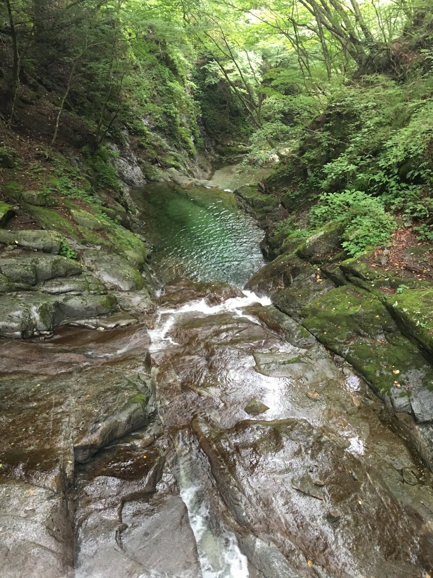 Looking down a multi tiered waterfall system